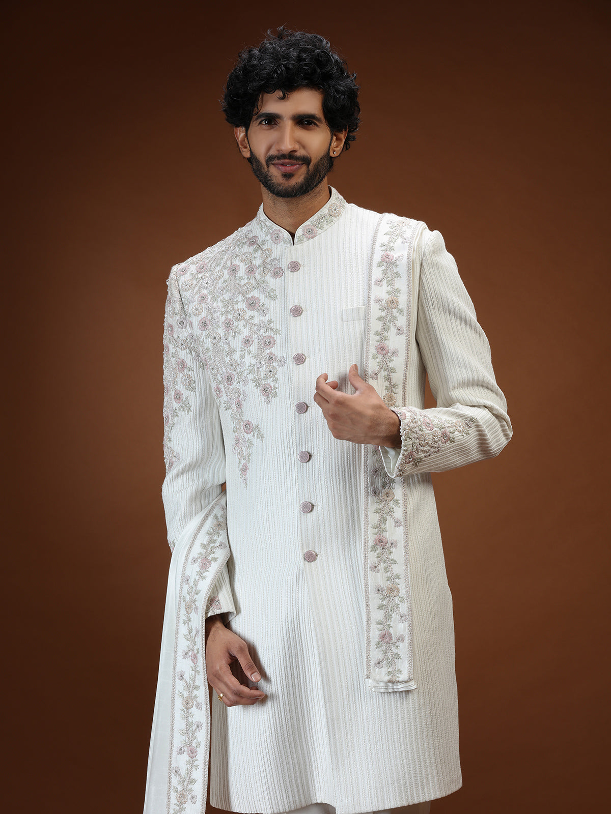 Cream silk mens sherwani with floral shoulder detailing