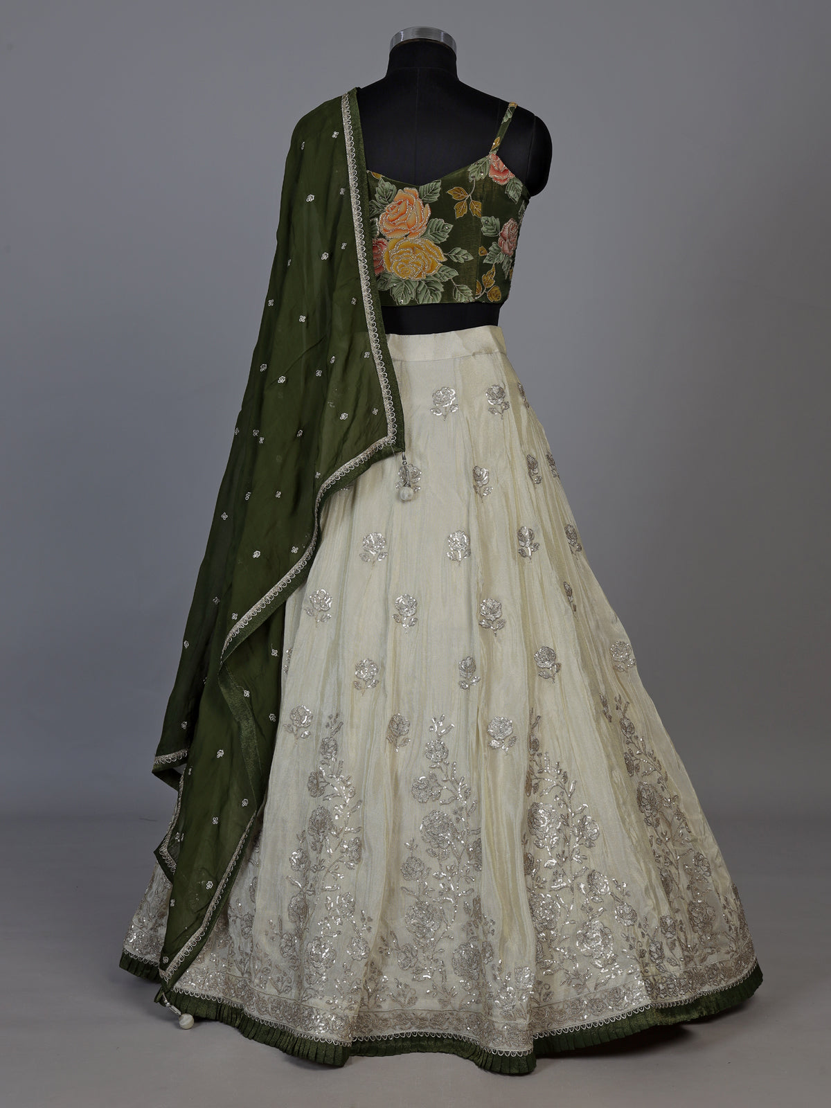 Regal mehendi green silk lehenga choli with intricate embellishments