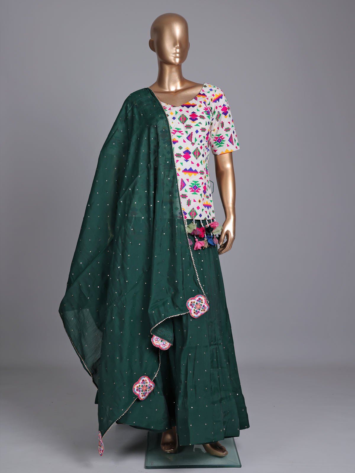 Dark green soft silk Navratri lehenga choli with stone detailing