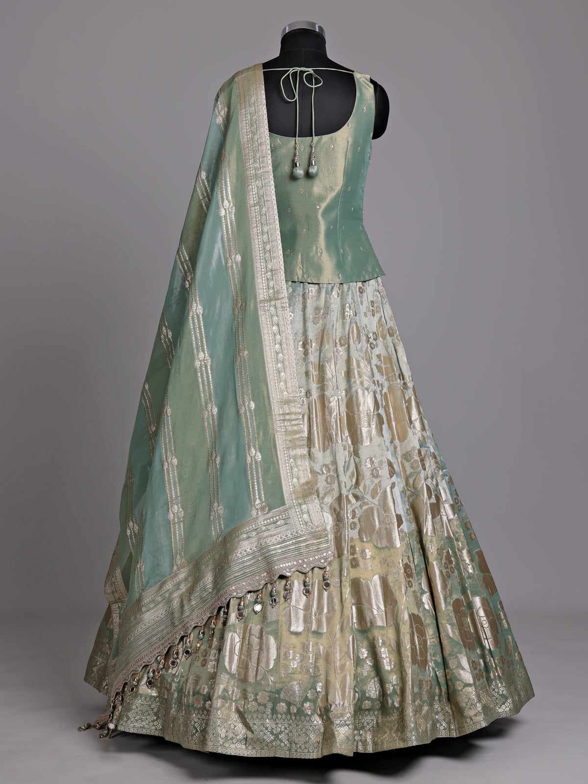 Pista green silk lehenga choli with mirror and zardosi work