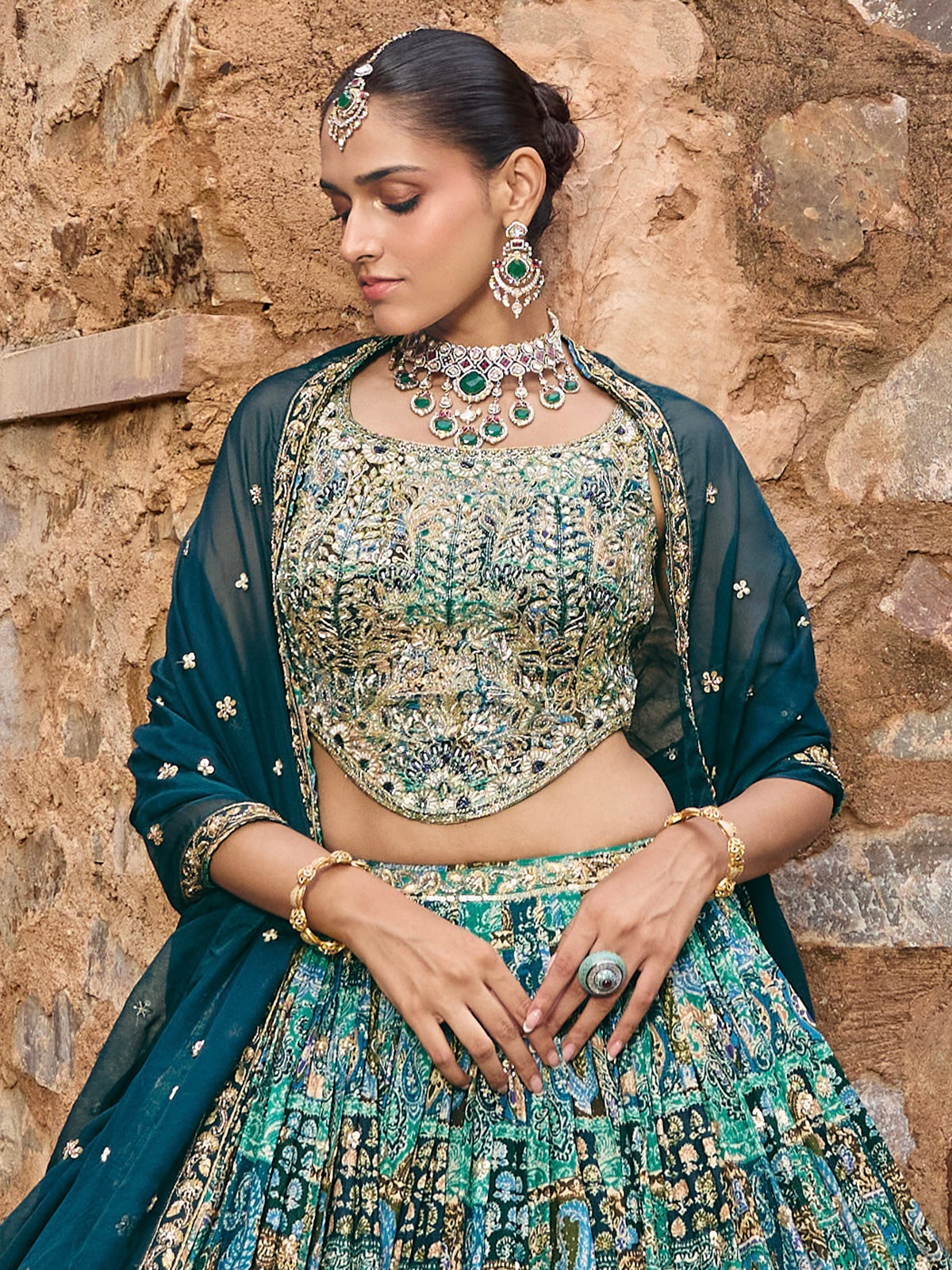 Peacock green silk lehenga choli with dupatta and embellishments