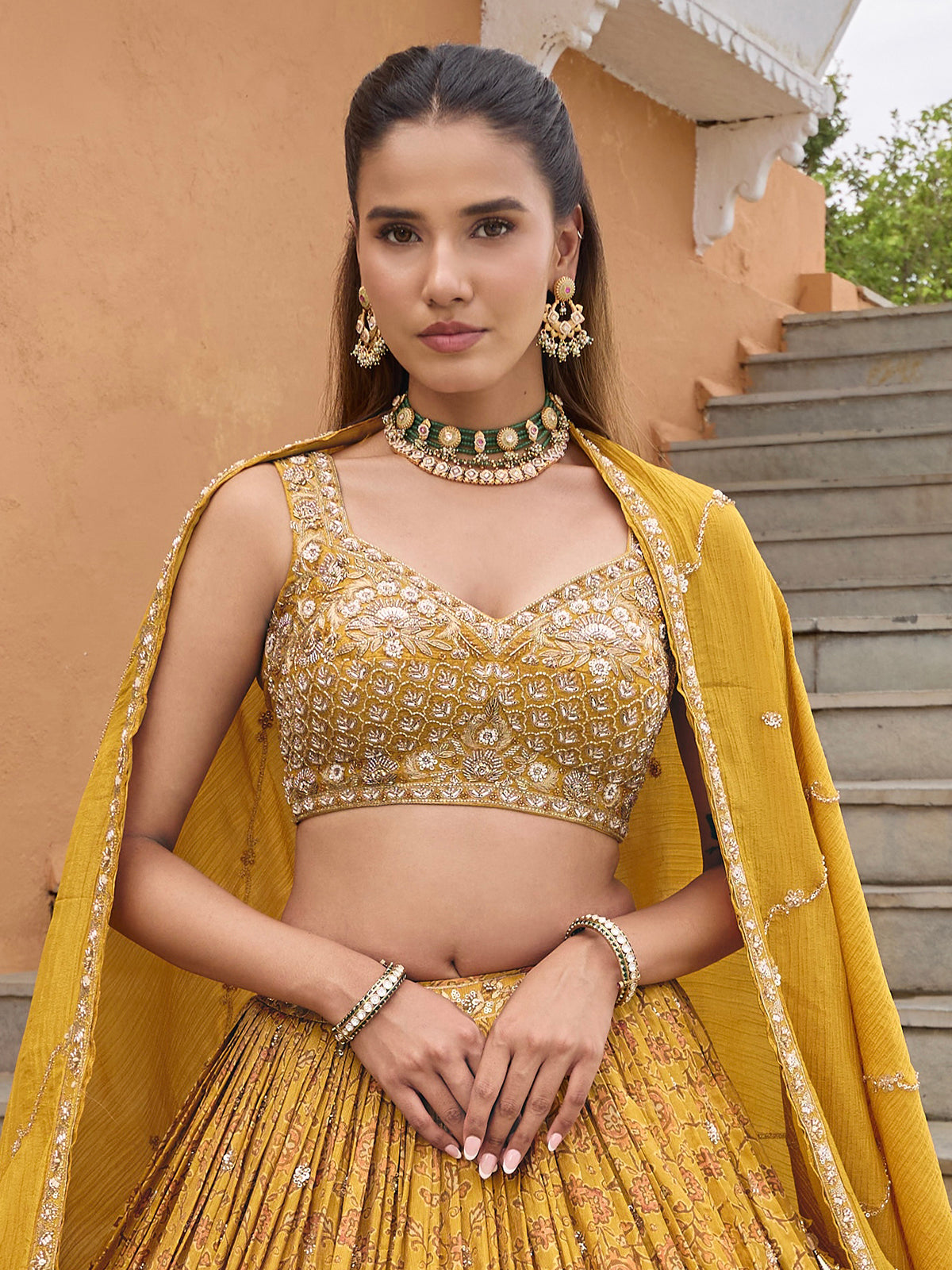 Mustard yellow silk lehenga choli with embellished dupatta