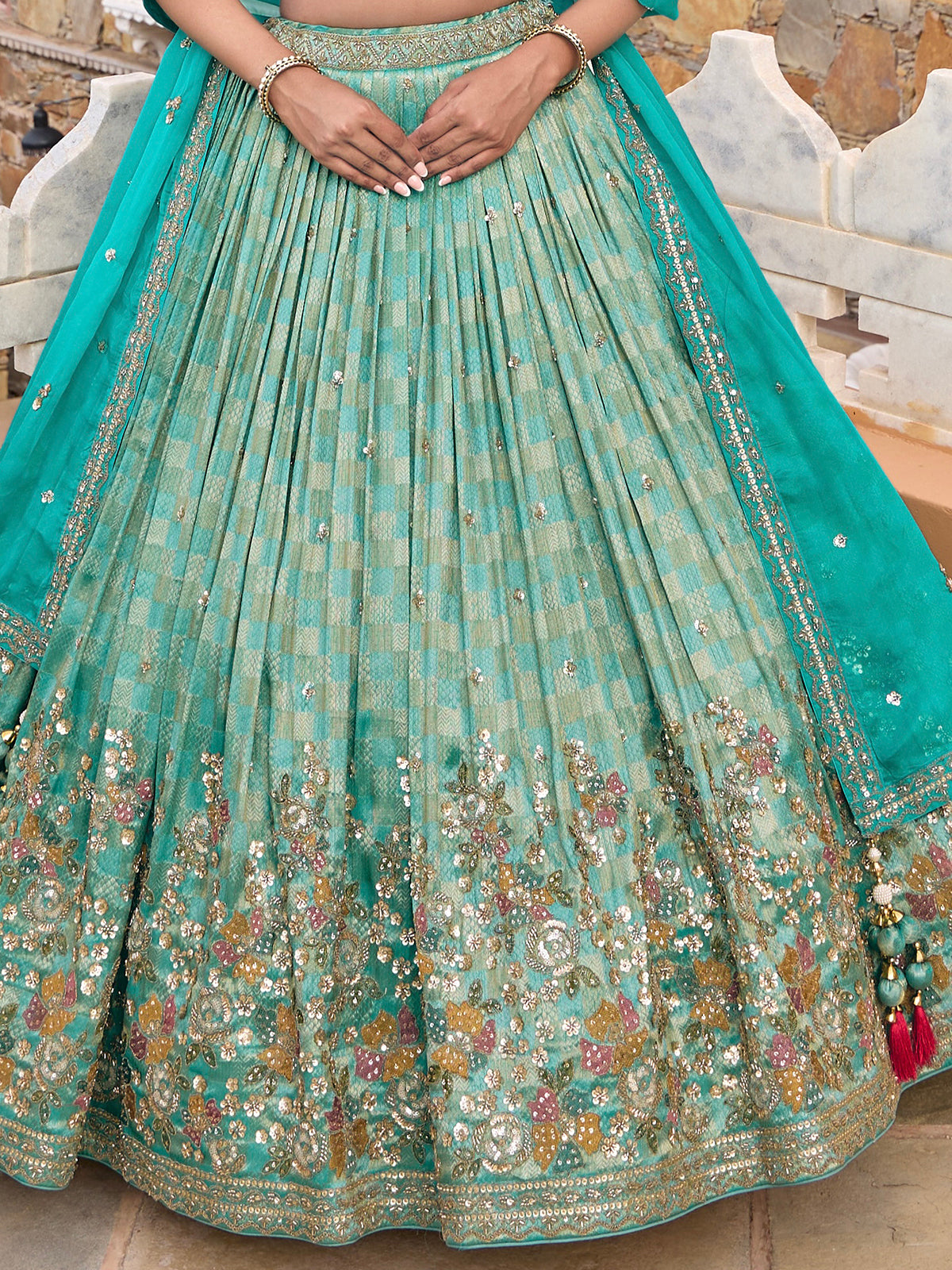 Aqua silk lehenga choli with checks texture and embellished dupatta