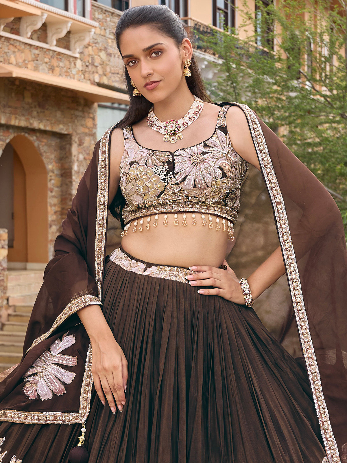 Dark brown soft silk lehenga choli with floral motif embellishments