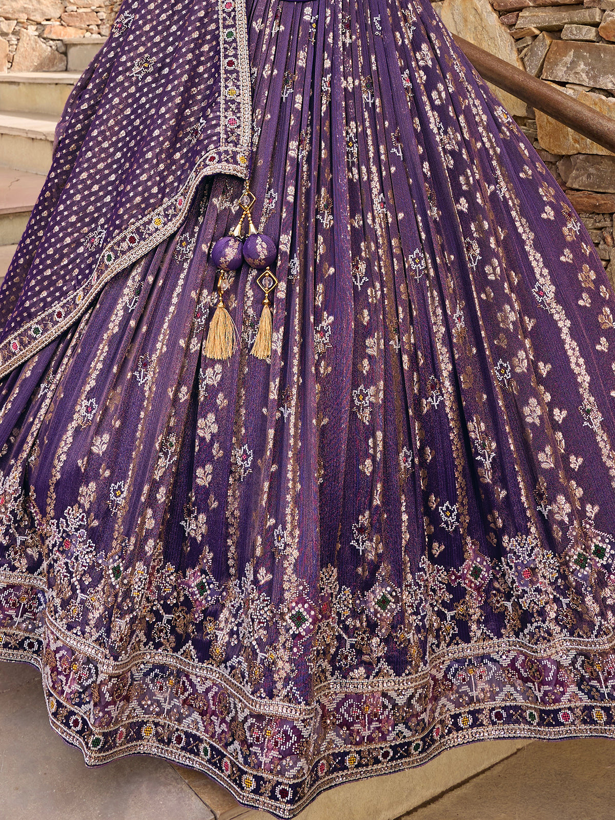 Purple silk lehenga choli with Rajasthani style embellished dupatta