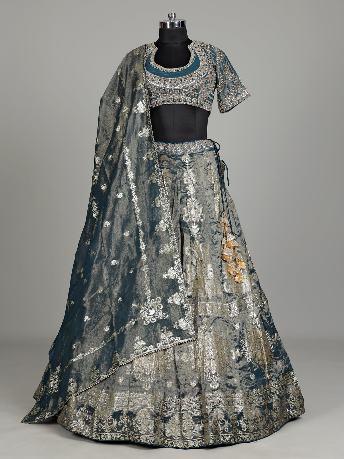Teal blue banarasi silk lehenga choli with embellished dupatta
