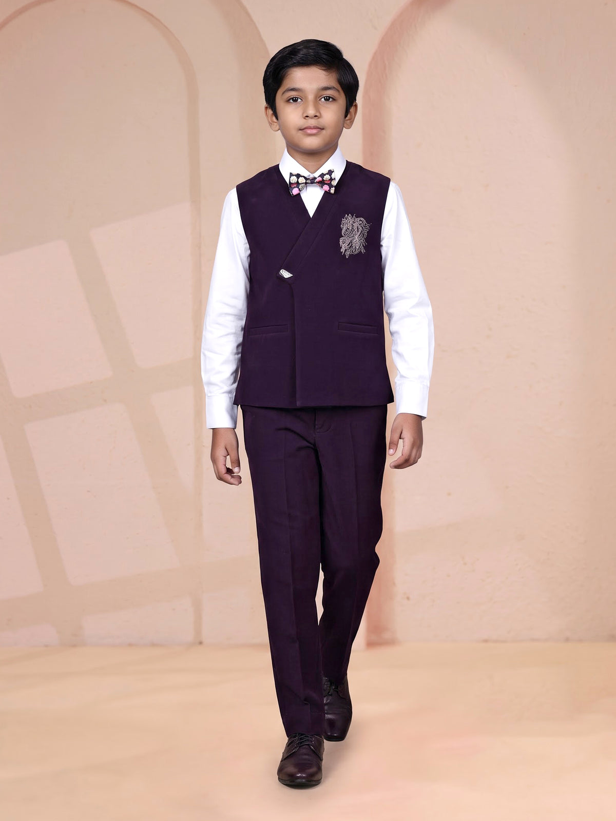 Wine boys waistcoat suit with embellished crest and bow tie