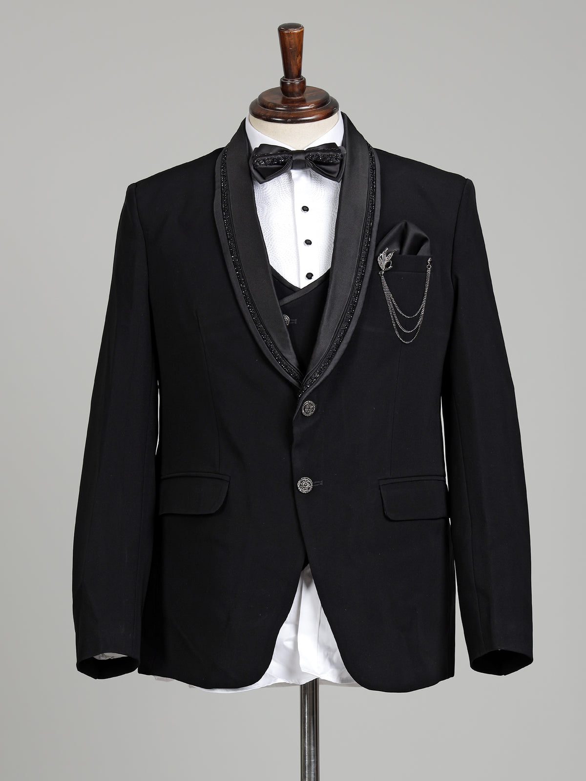 Black three-piece tuxedo suit with crystal bow tie