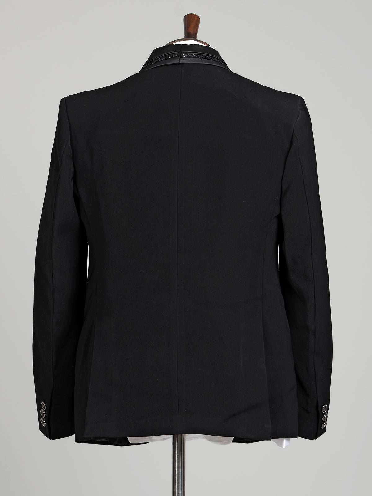 Black three-piece tuxedo suit with crystal bow tie