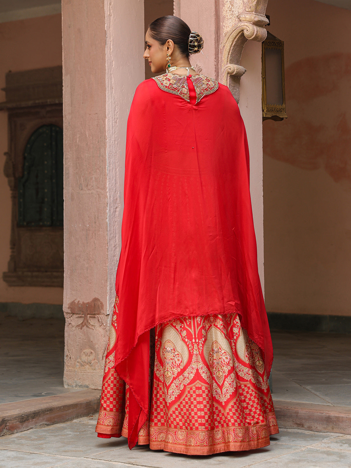 Red traditional printed lehenga choli with heavy work cape jacket