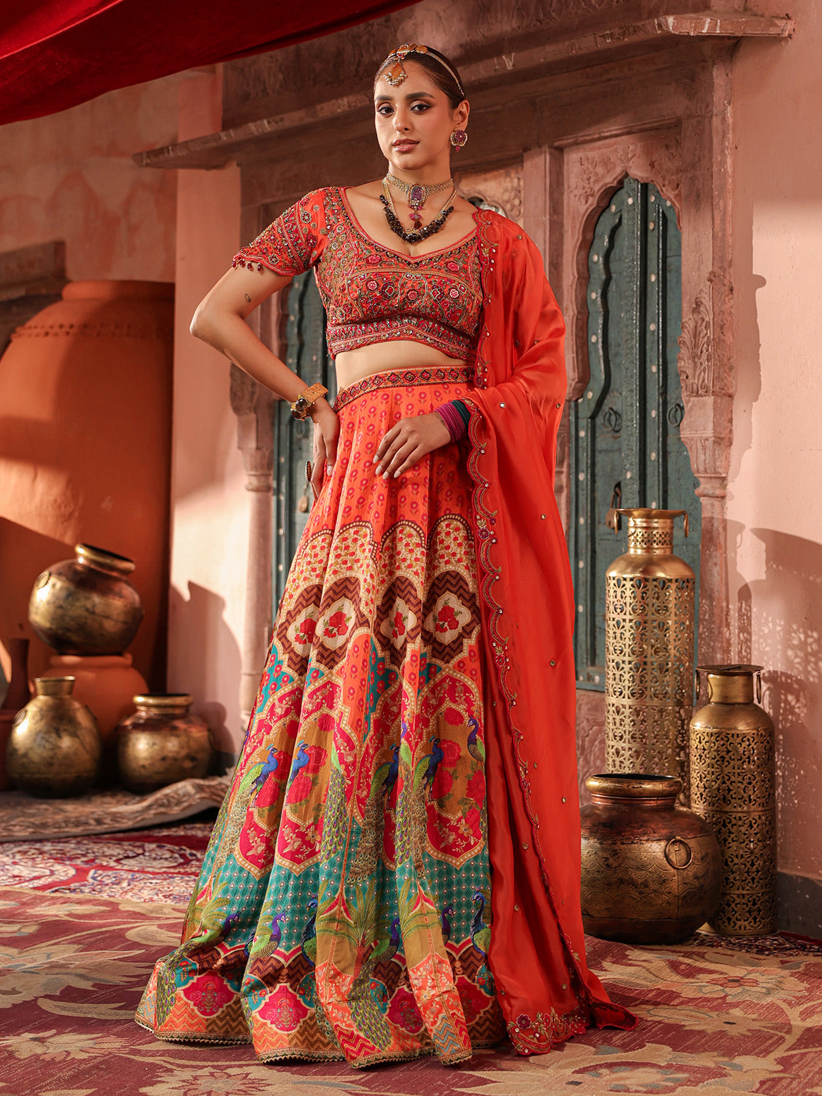 Red traditional print lehenga choli with elegant embellished dupatta