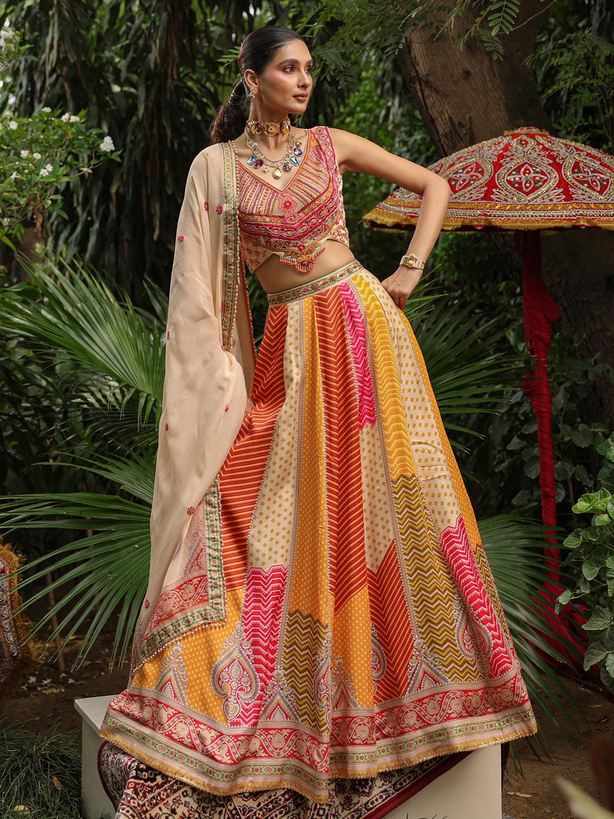 Multicolor geometric print lehenga choli with heavy embellished blouse
