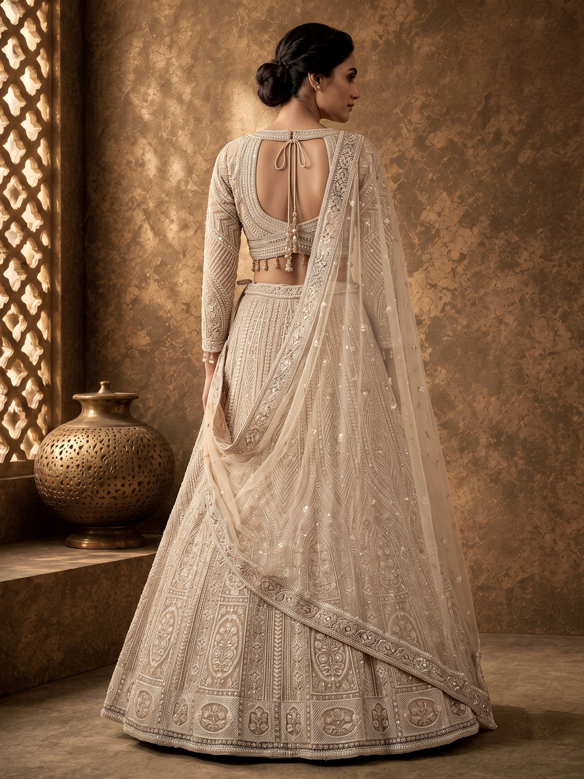 Beige net designer lehenga choli with embellished dupatta