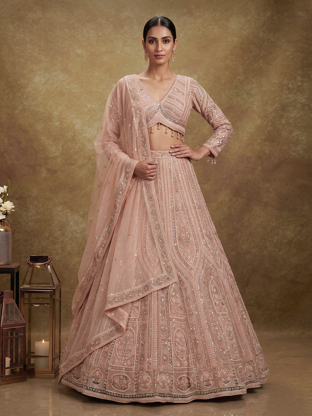 Peach net designer lehenga choli with intricate embellished dupatta