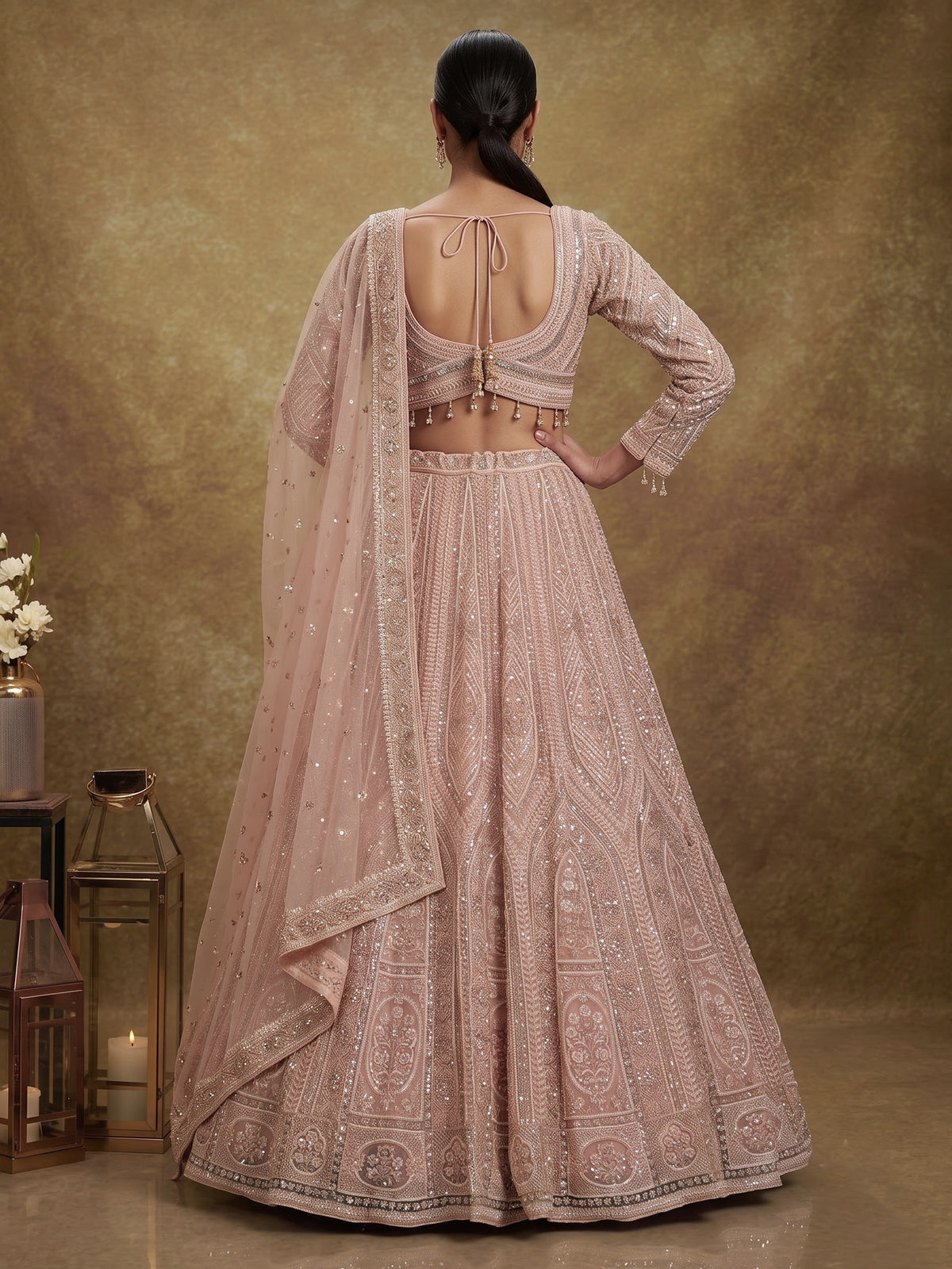 Peach net designer lehenga choli with intricate embellished dupatta