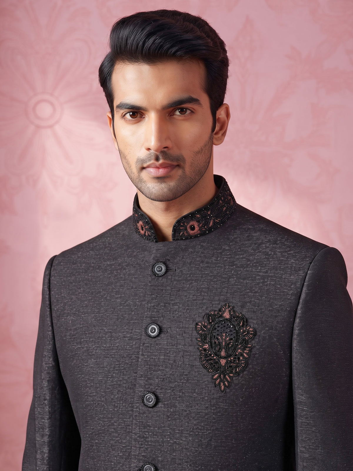 Jet black textured jodhpuri suit for mens with crest motif
