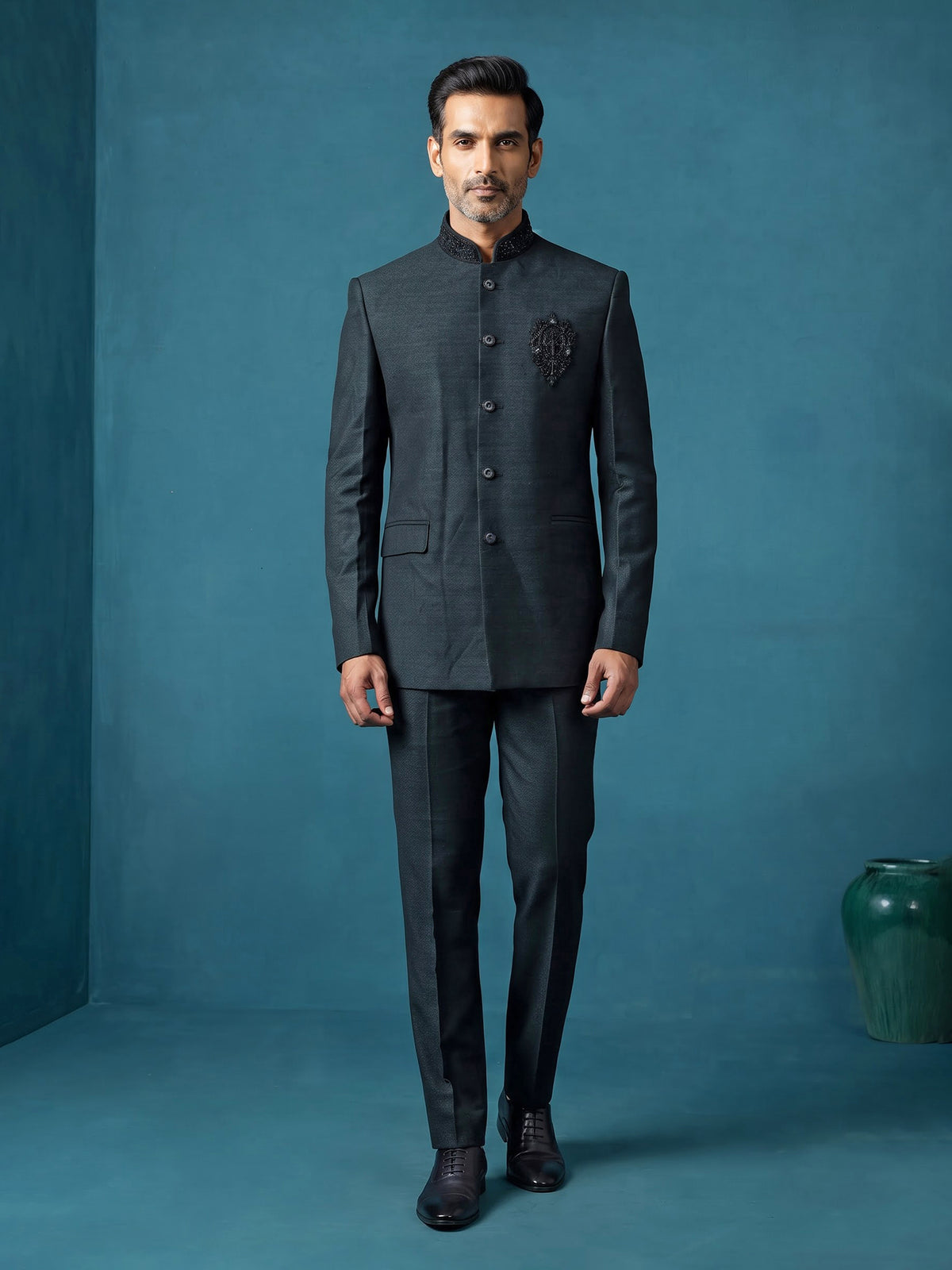 Deep emerald green textured jodhpuri suit for mens with crest