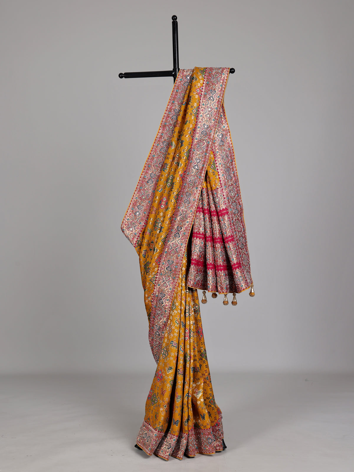 Mustard yellow modal silk Patola motif zari work saree