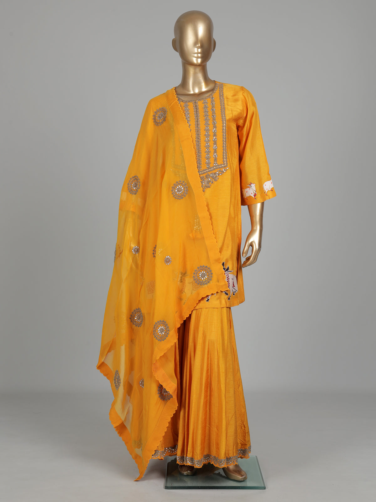 Mustard yellow silk sharara suit with animal motifs and gota work
