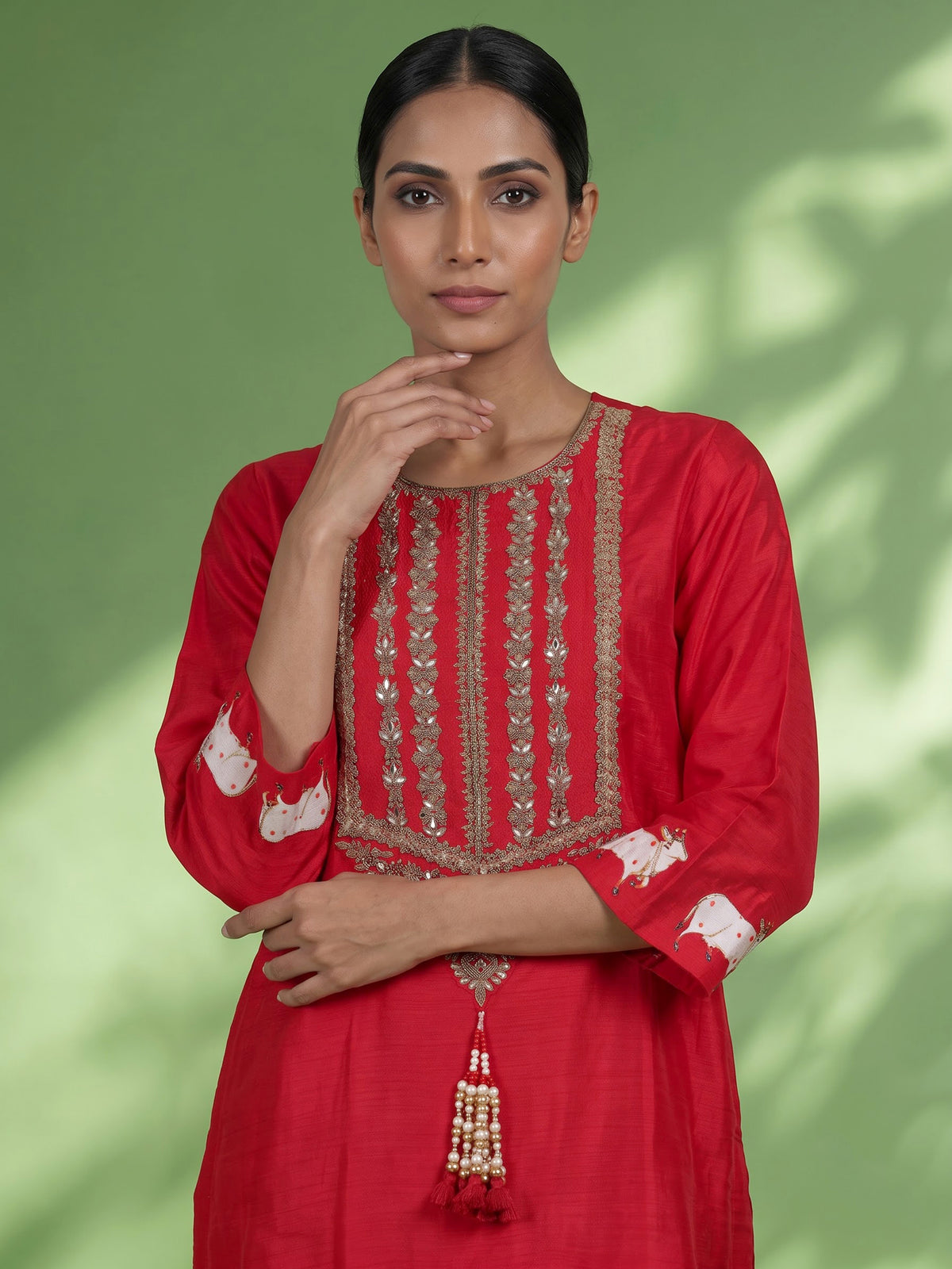 Red silk sharara suit with animal motifs, zardosi and gota detailing