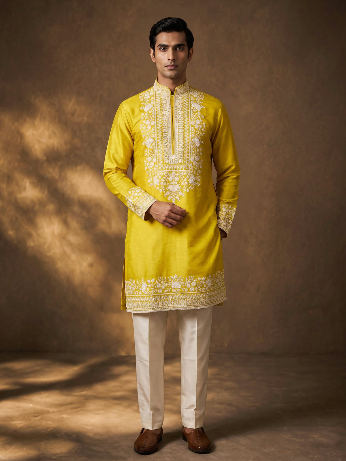 Mustard yellow silk kurta suit with ornate embellished yoke