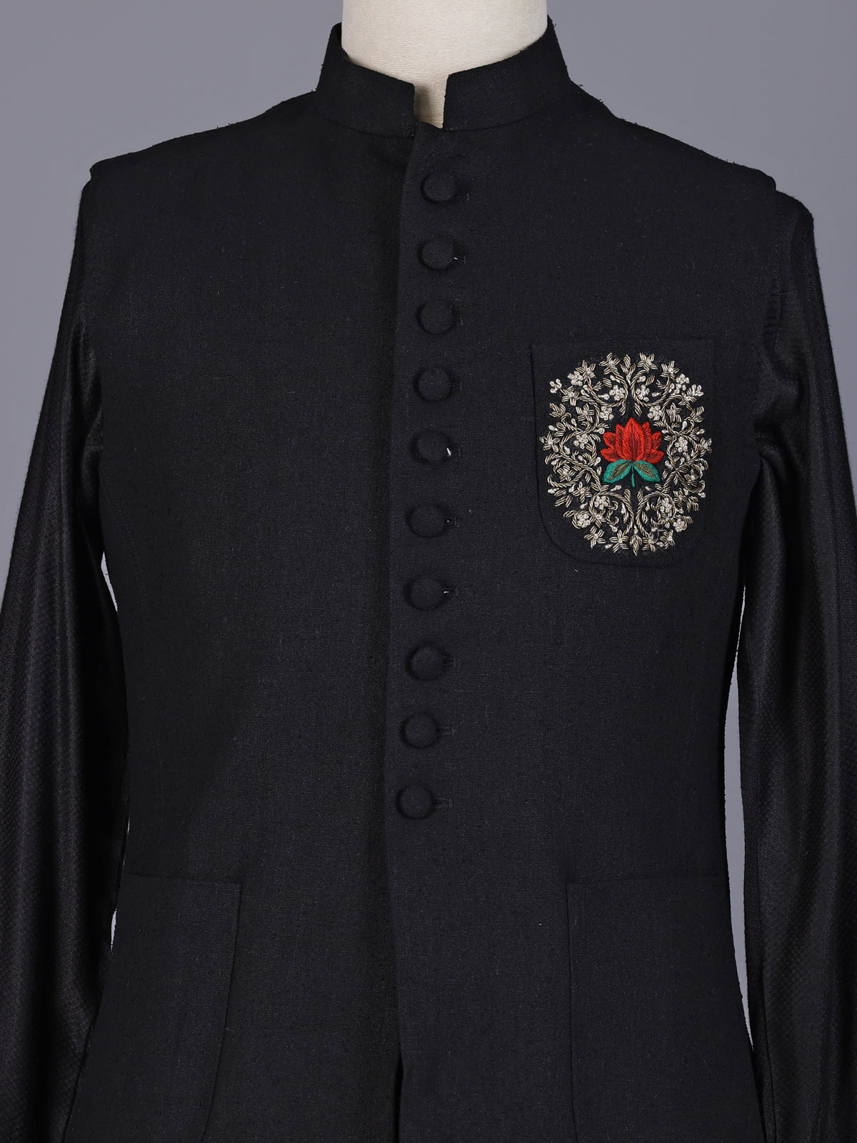 Black textured silk-blend waistcoat set with zardosi crest detailing