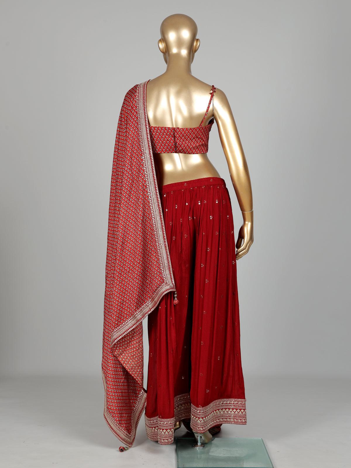 Maroon chiffon georgette palazzo suit with cutdana and tassel detailing