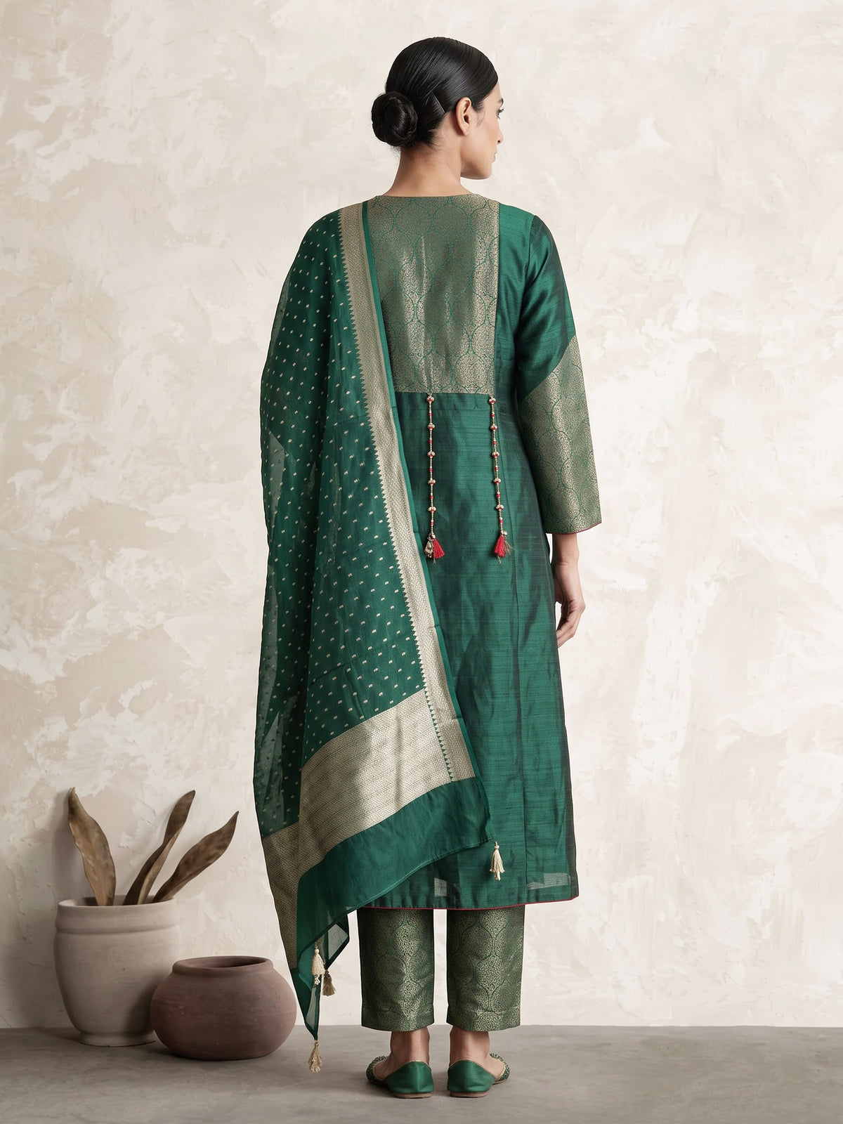 Green silk anarkali with cutdana, zardosi, stone diamond zari work