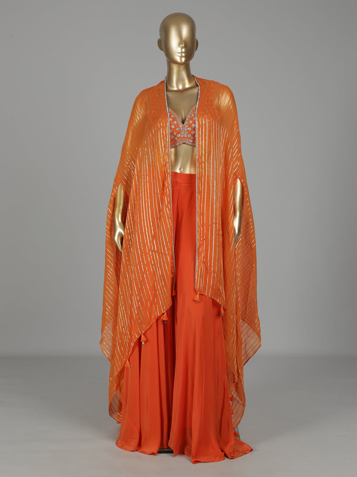 Orange satin silk designer salwar suit with embellished shrug