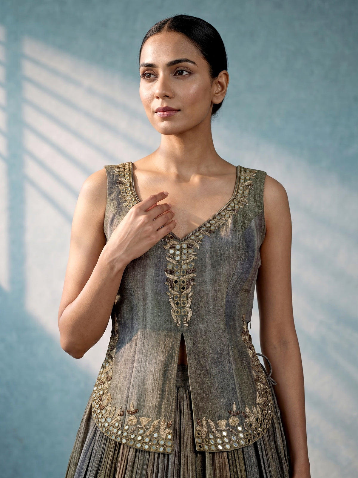 Mehendi green shaded silk lehenga choli with ornate embellishments