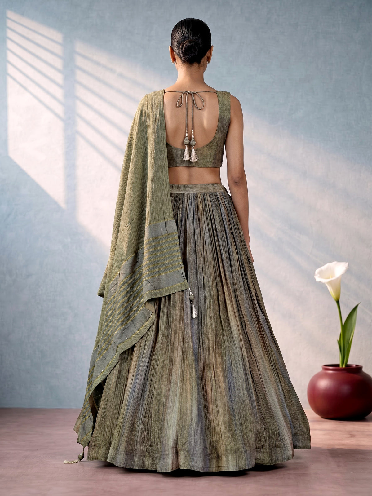 Mehendi green shaded silk lehenga choli with ornate embellishments