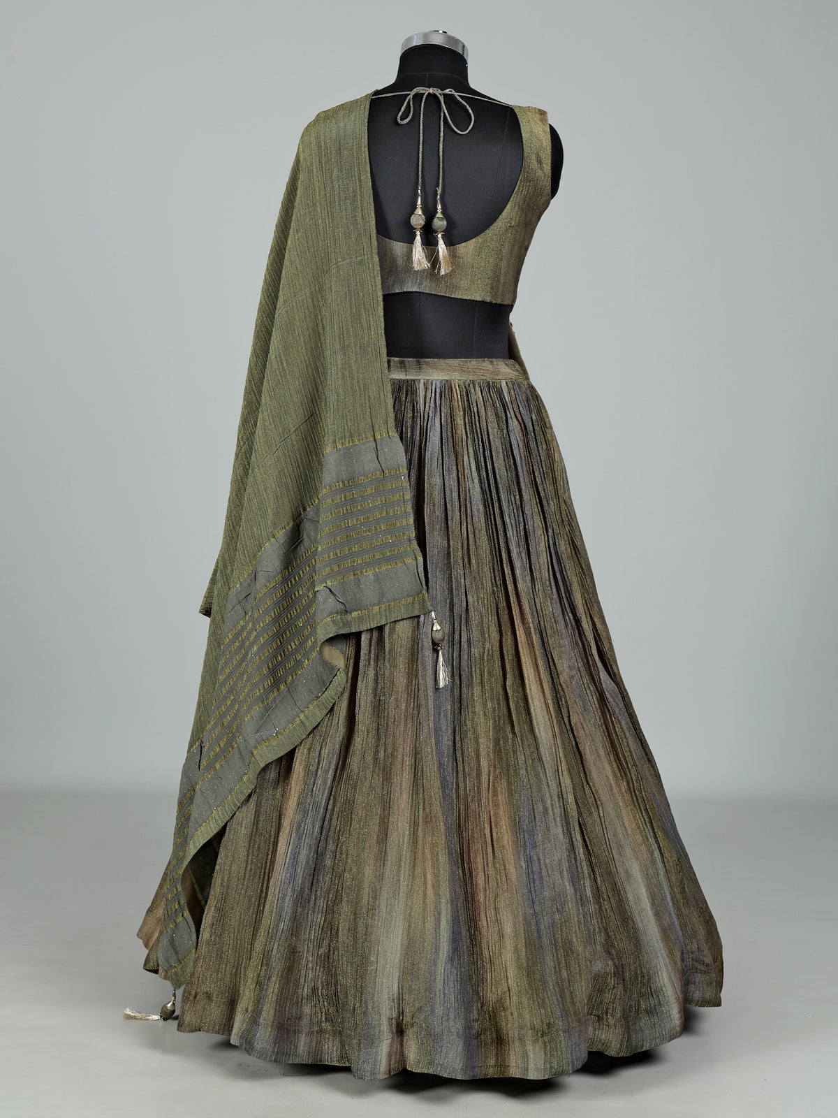 Mehendi green shaded silk lehenga choli with ornate embellishments