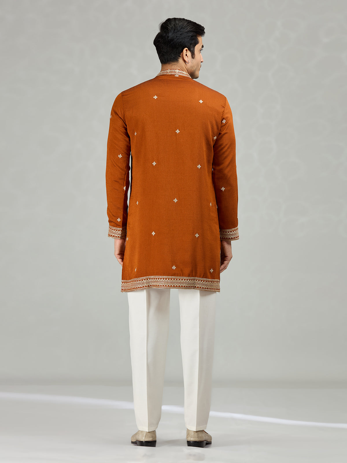 Rust orange statement embroidered men kurta suit