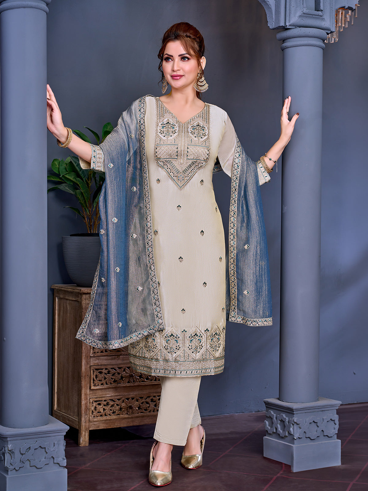 Cream shimmer salwar suit with blue contrast dupatta and embroidered yoke