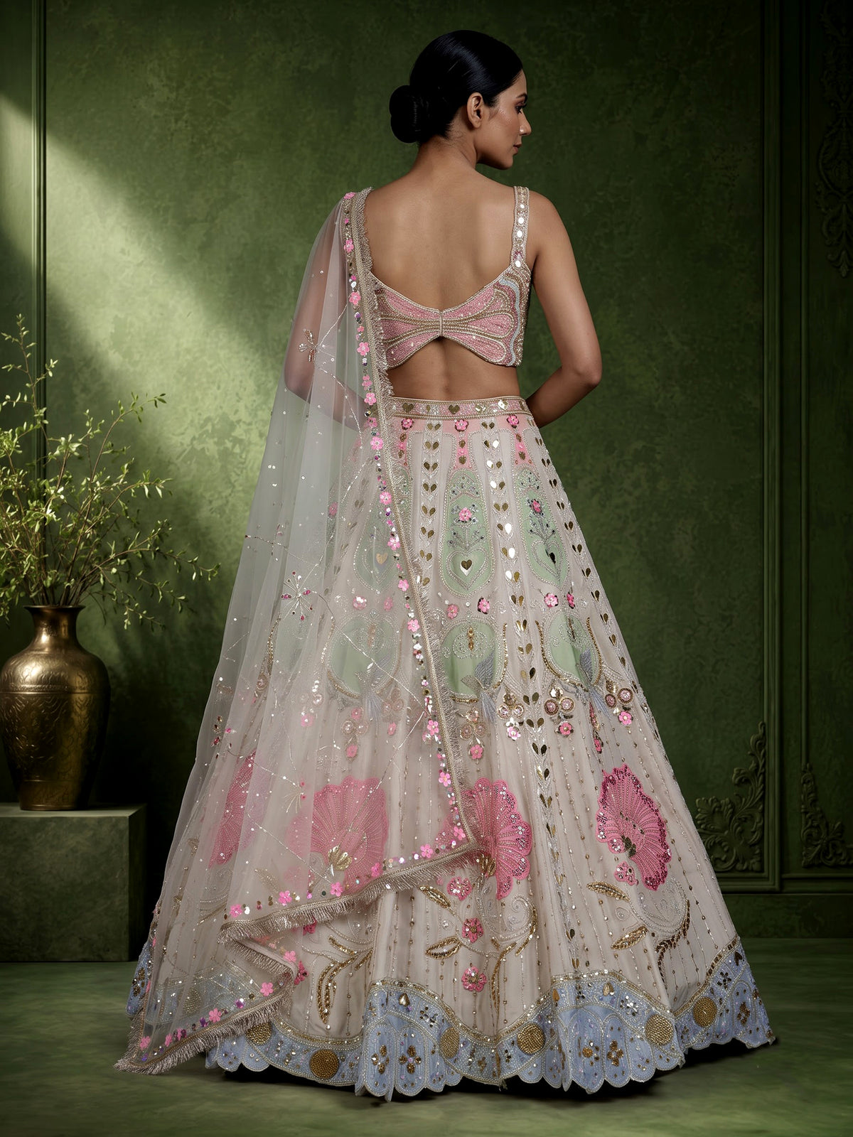 Beige silk lehenga choli with pearl and diamond embellishments