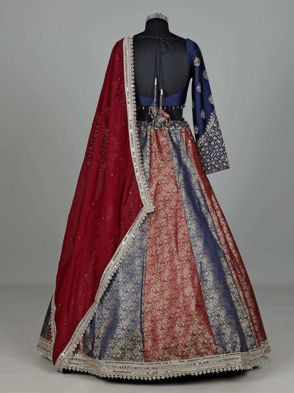 Navy blue brocade lehenga choli with mirror and zari embellishments