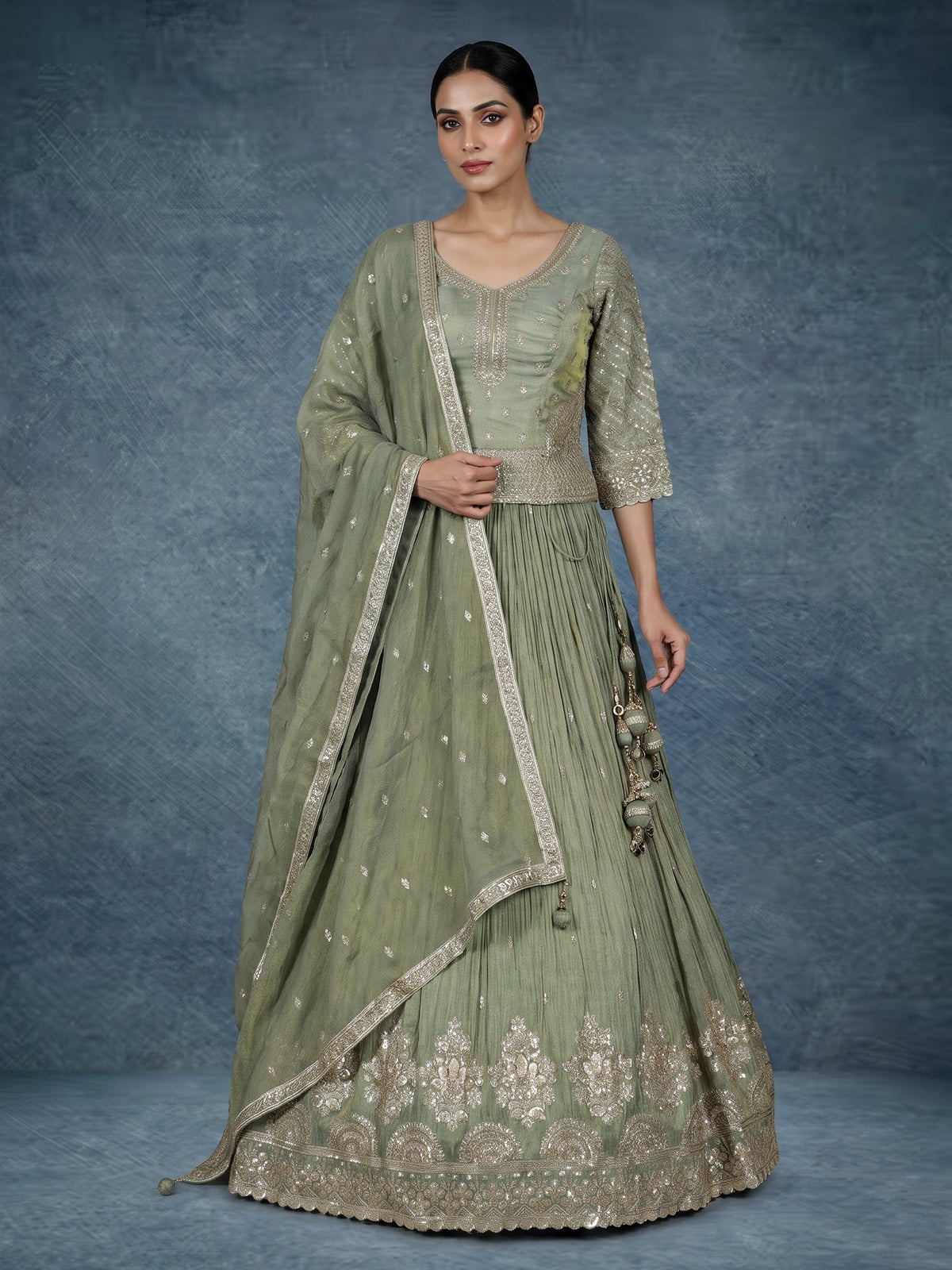 Pista green silk lehenga choli with sparkling zardosi embellishments