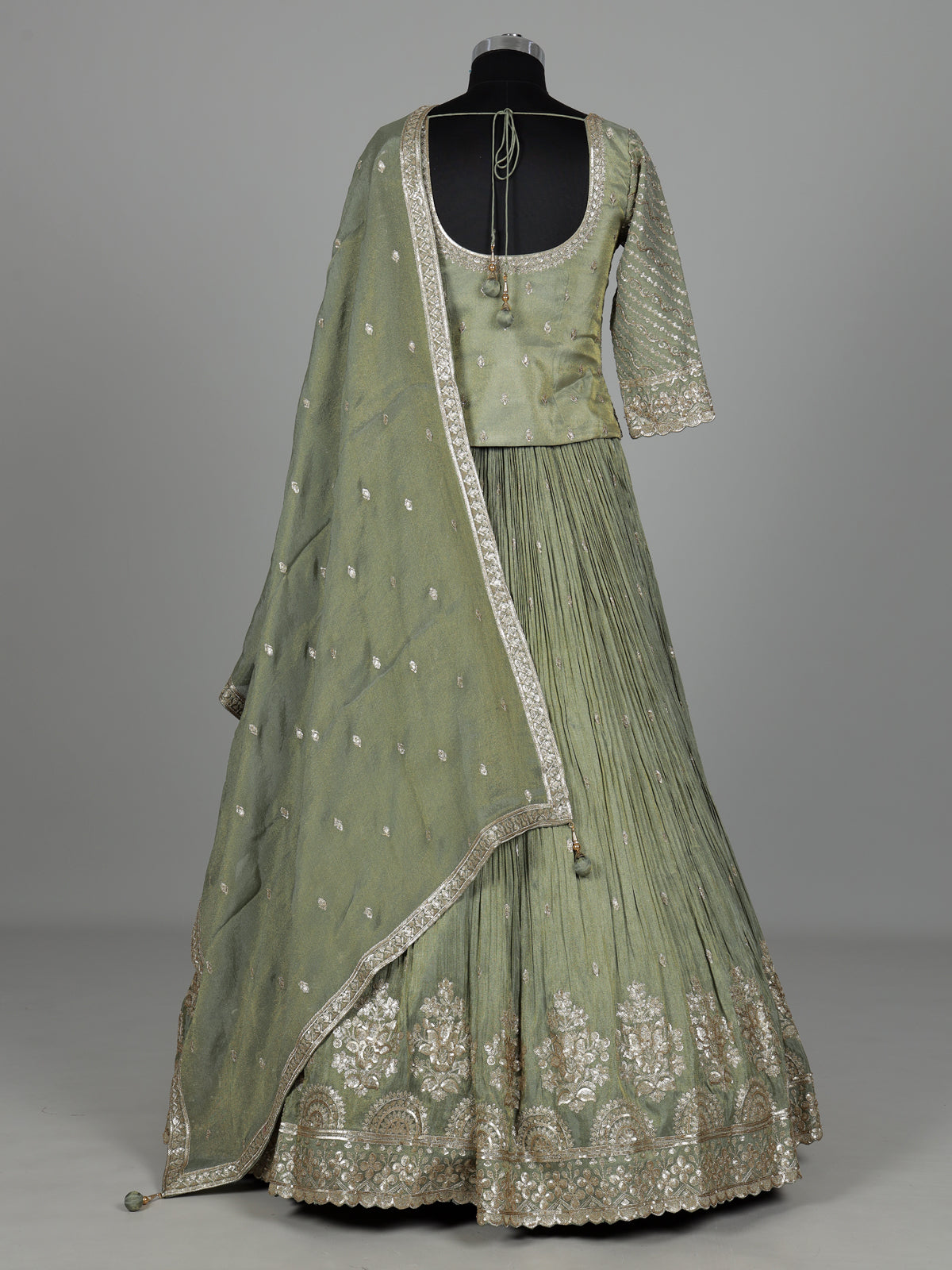 Pista green silk lehenga choli with sparkling zardosi embellishments