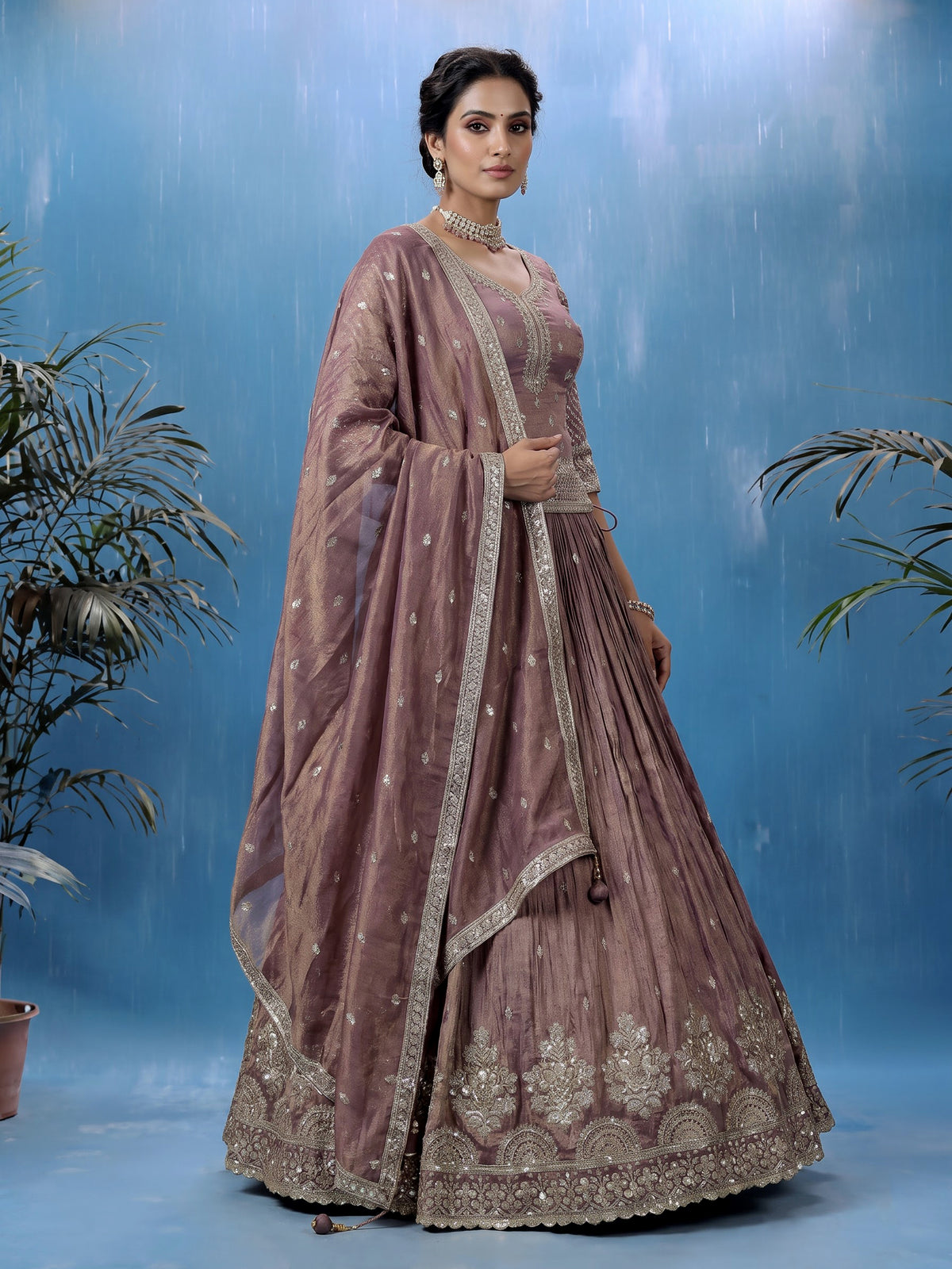 Pastel purple silk lehenga choli with intricate zardosi work