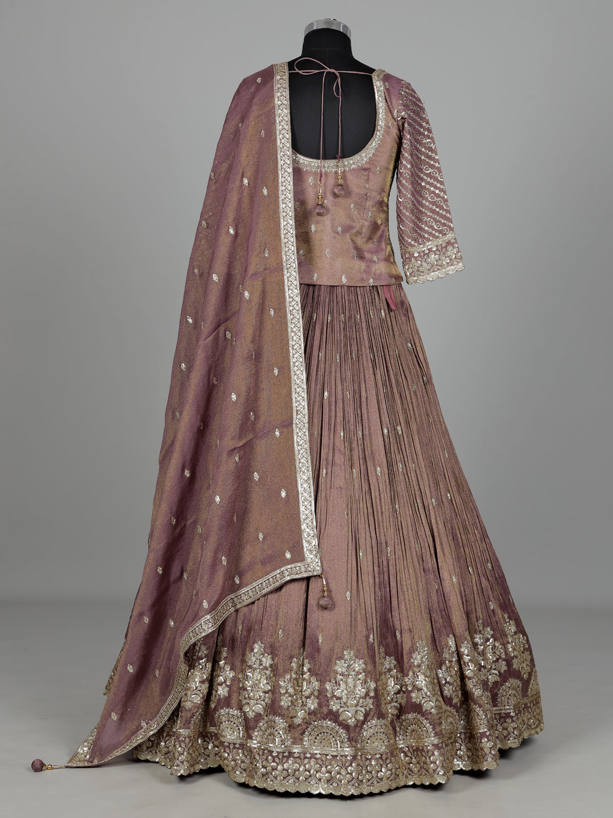 Pastel purple silk lehenga choli with intricate zardosi work