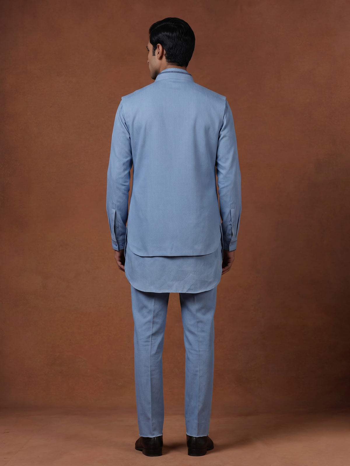 Sky blue waistcoat set with embellished brooch