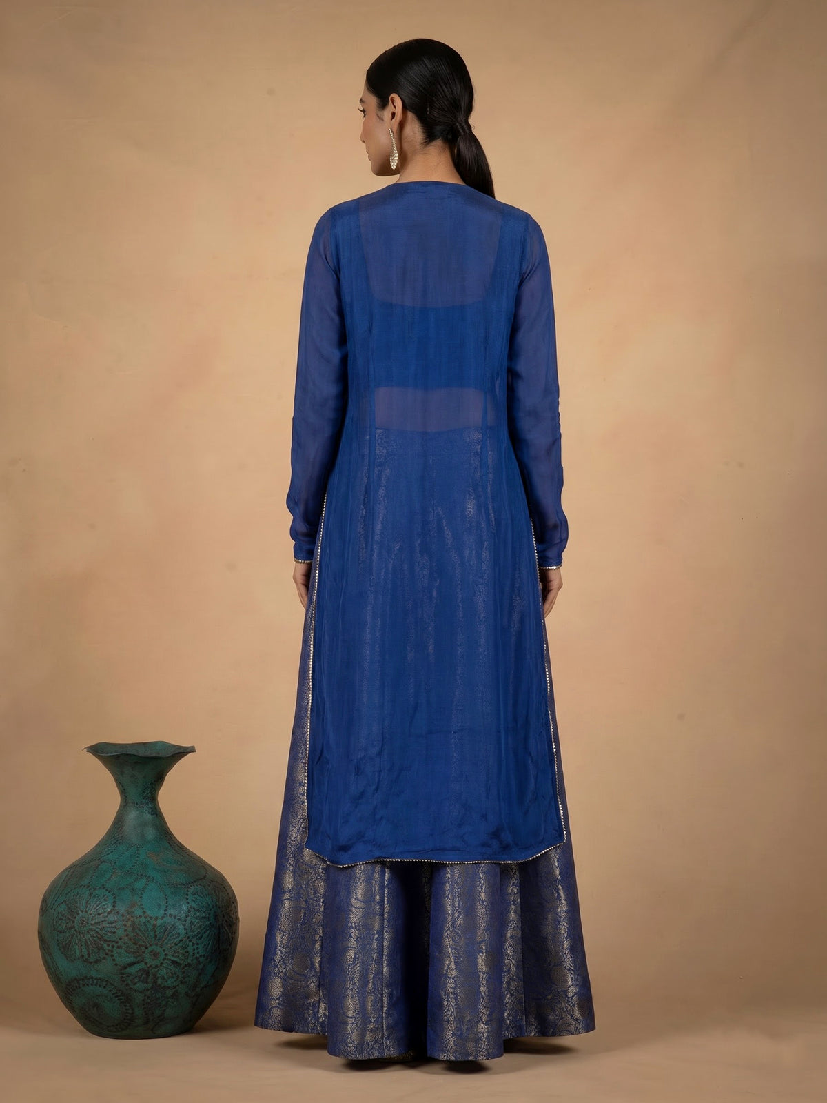 Elegant blue designer palazzo suit with intricate mirror and zardosi work