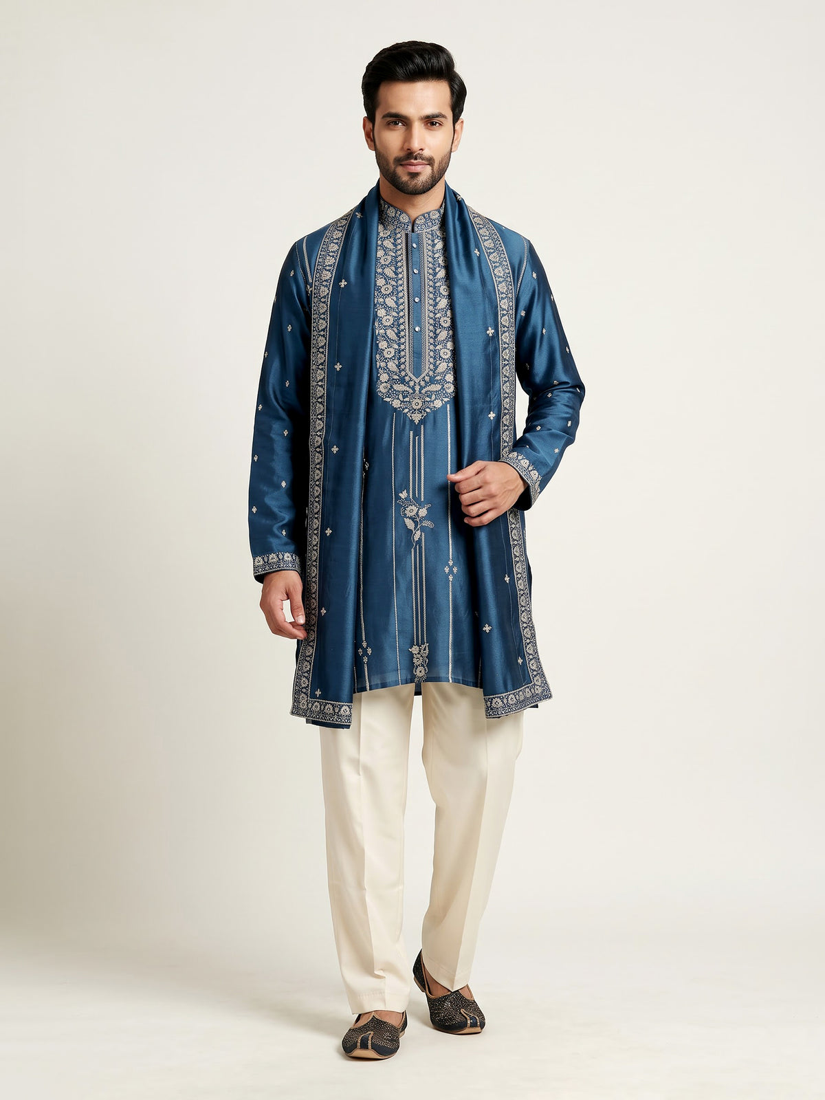 Deep teal silk kurta suit with golden embroidered neckline