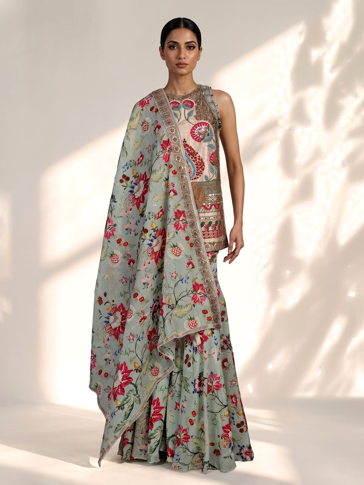 Pista green pakistani sharara suit with bird motifs and embroidery