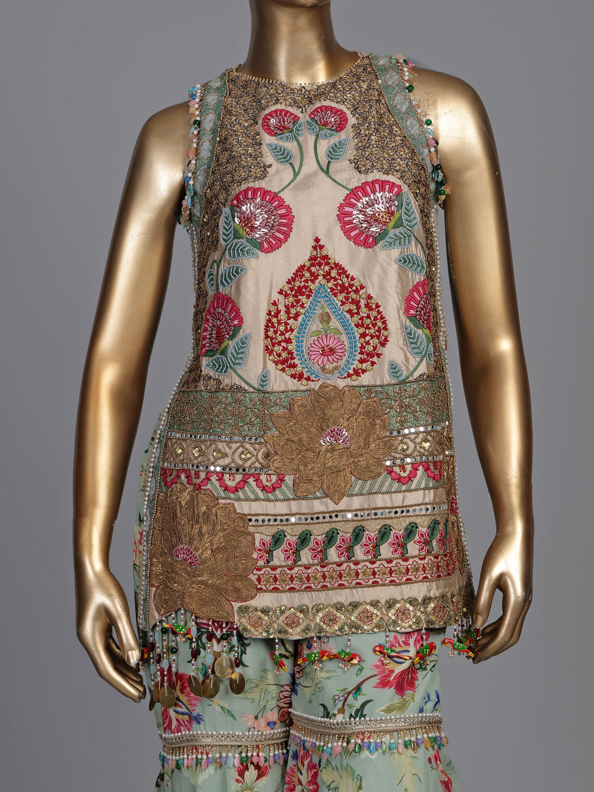 Pista green pakistani sharara suit with bird motifs and embroidery