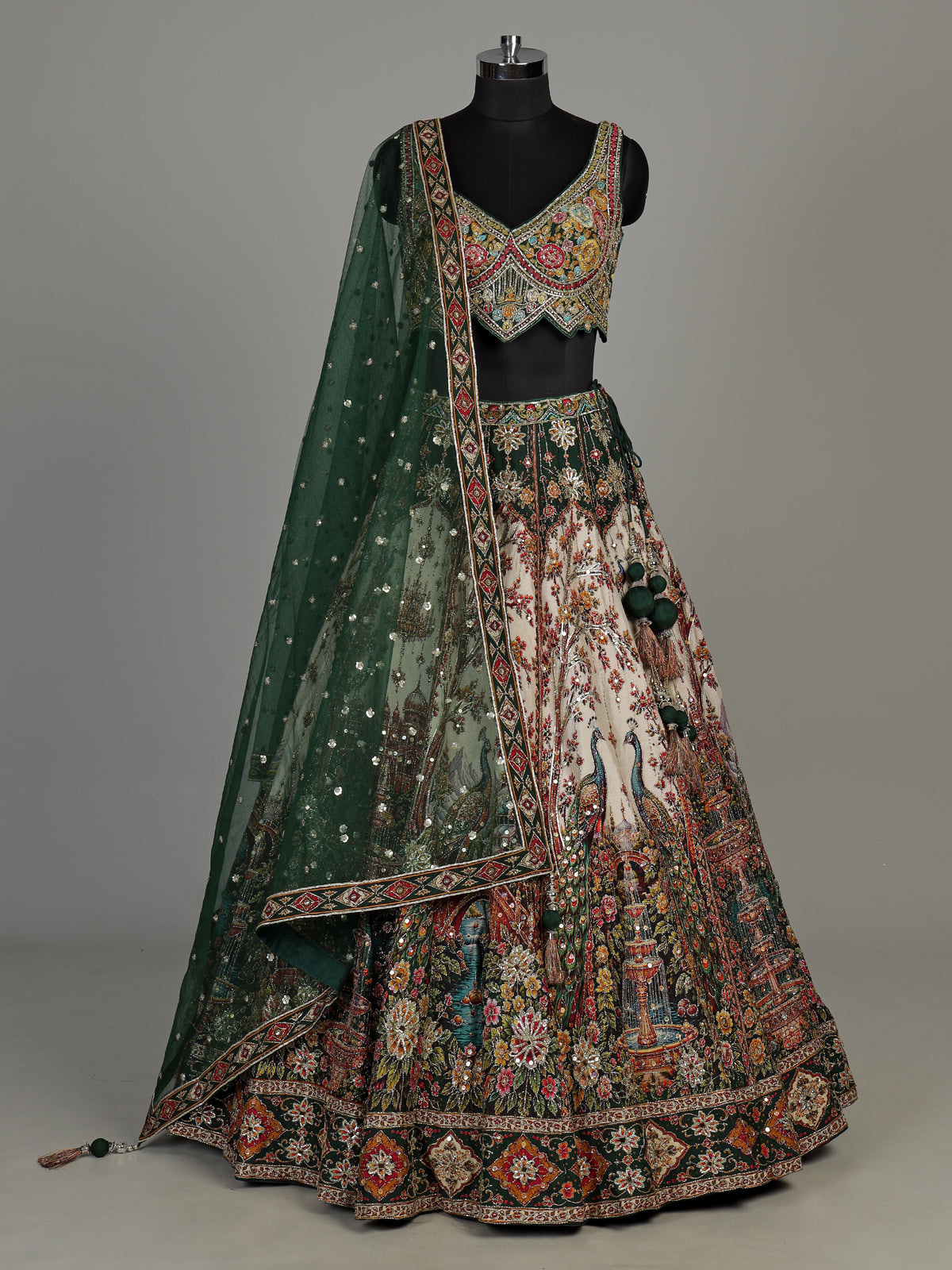 Green silk peacock motif lehenga choli with zardosi detailing