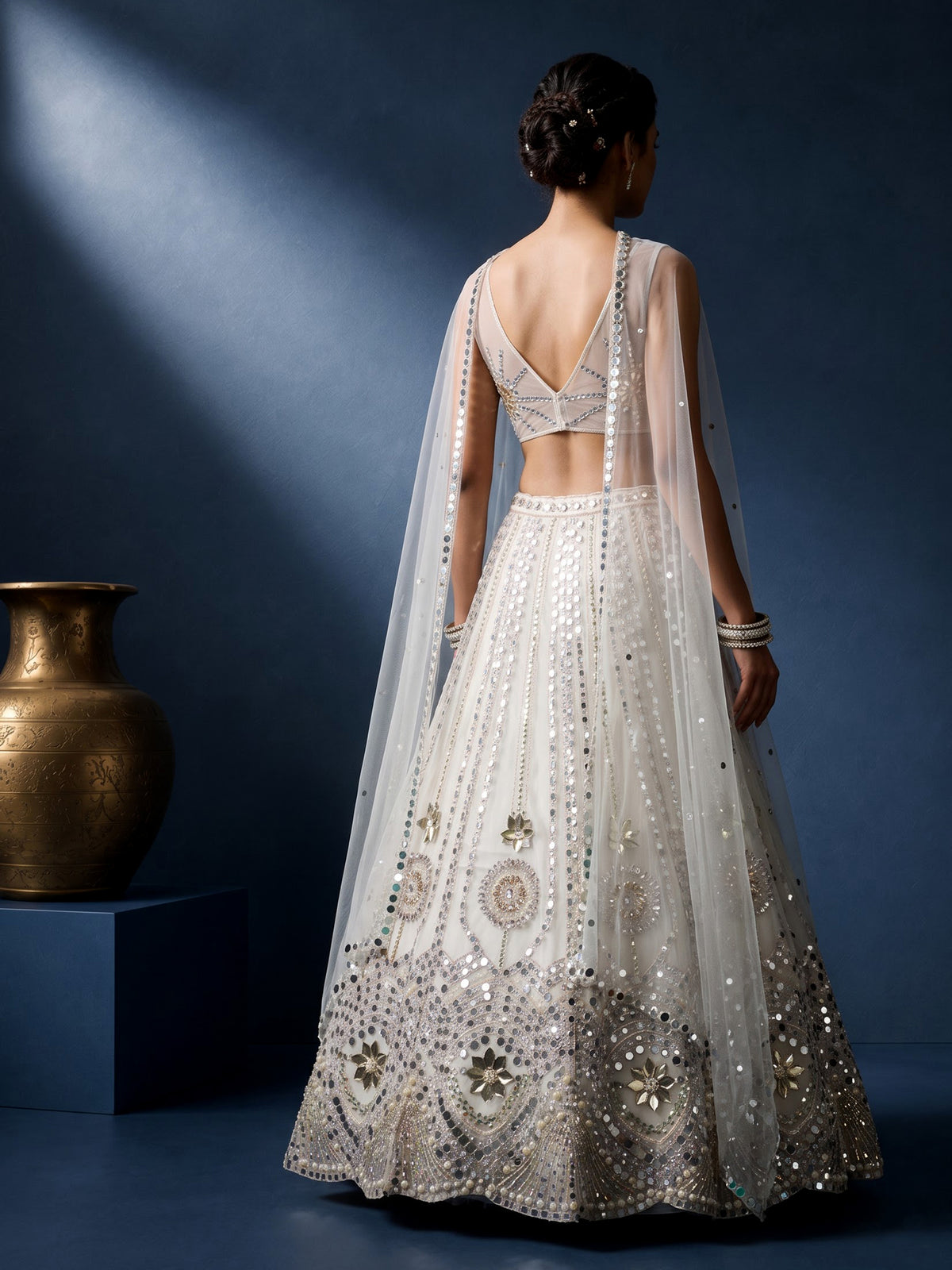 White net designer lehenga choli with sparkling diamond embellishments