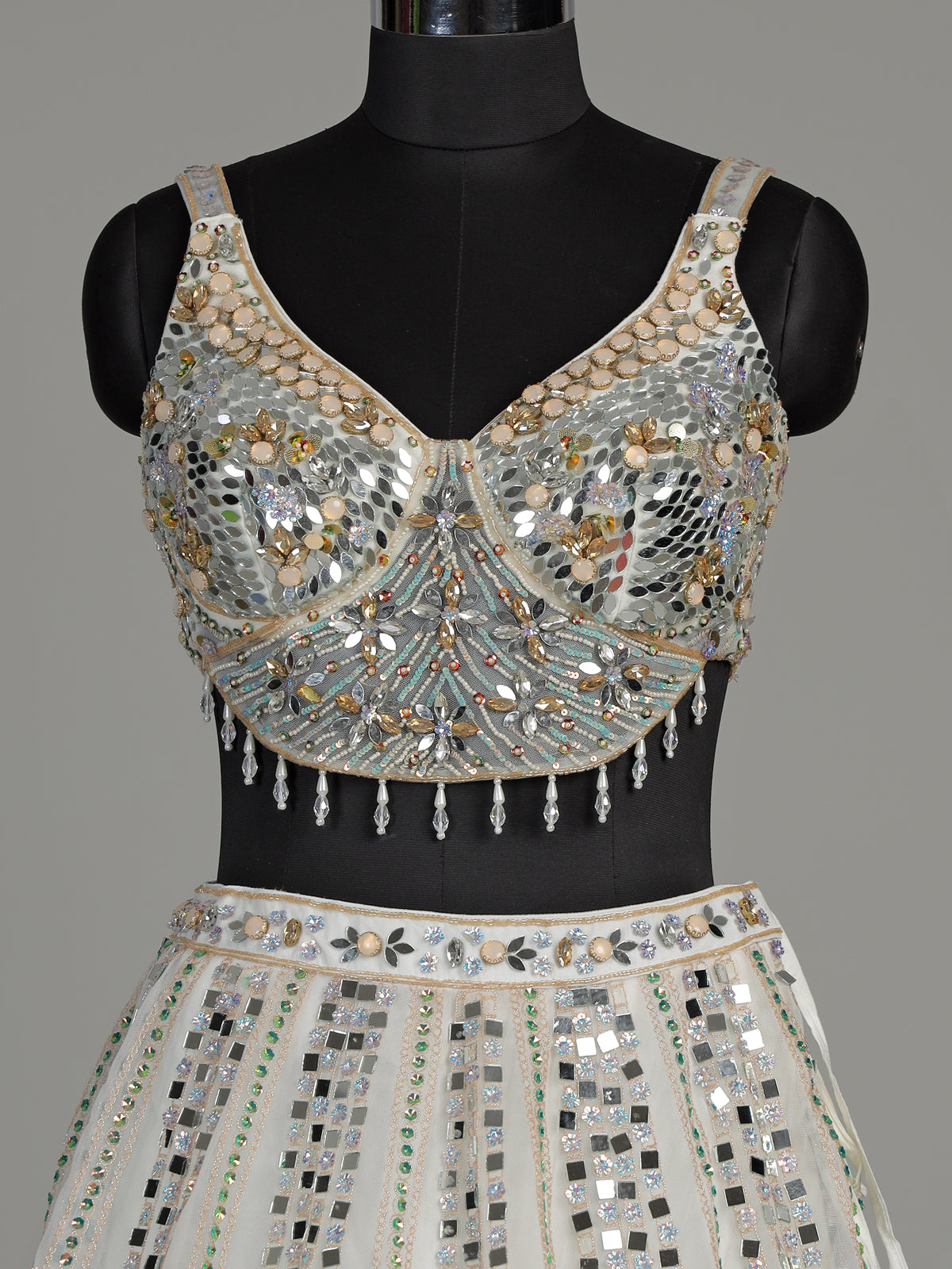 White net designer lehenga choli with sparkling diamond embellishments