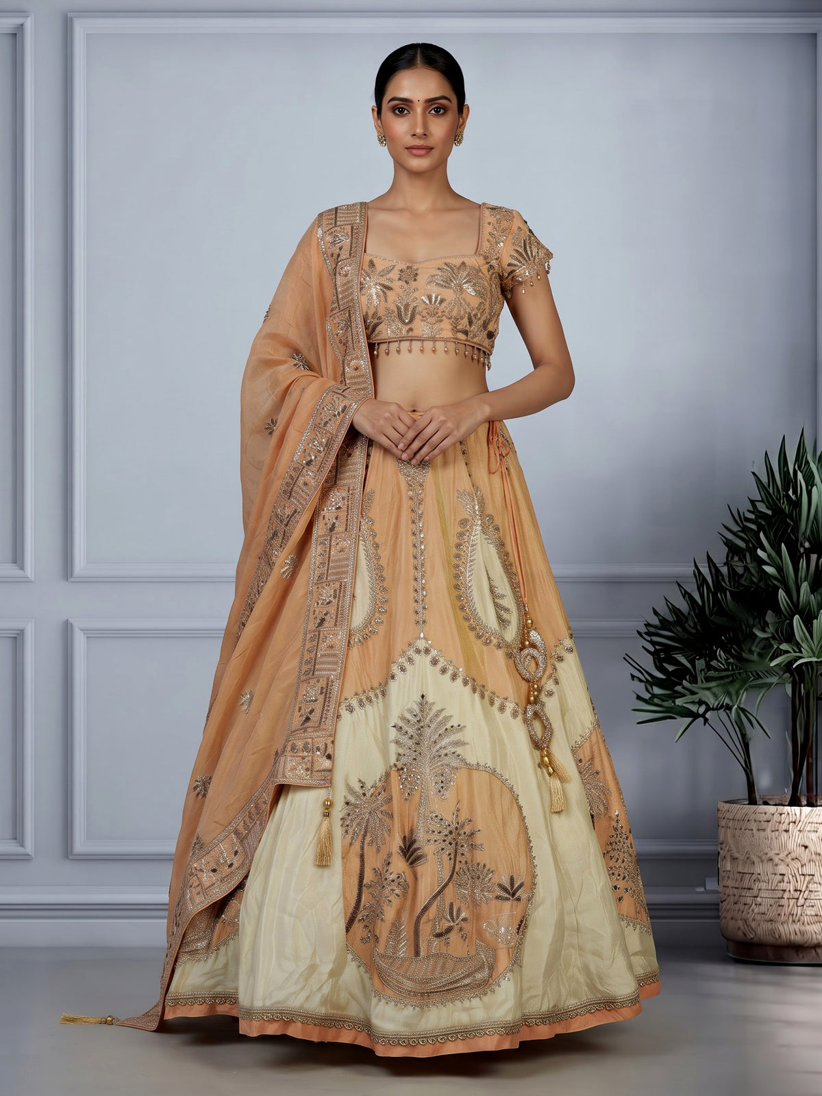 Peach silk lehenga choli with zardosi cap sleeve embellishments