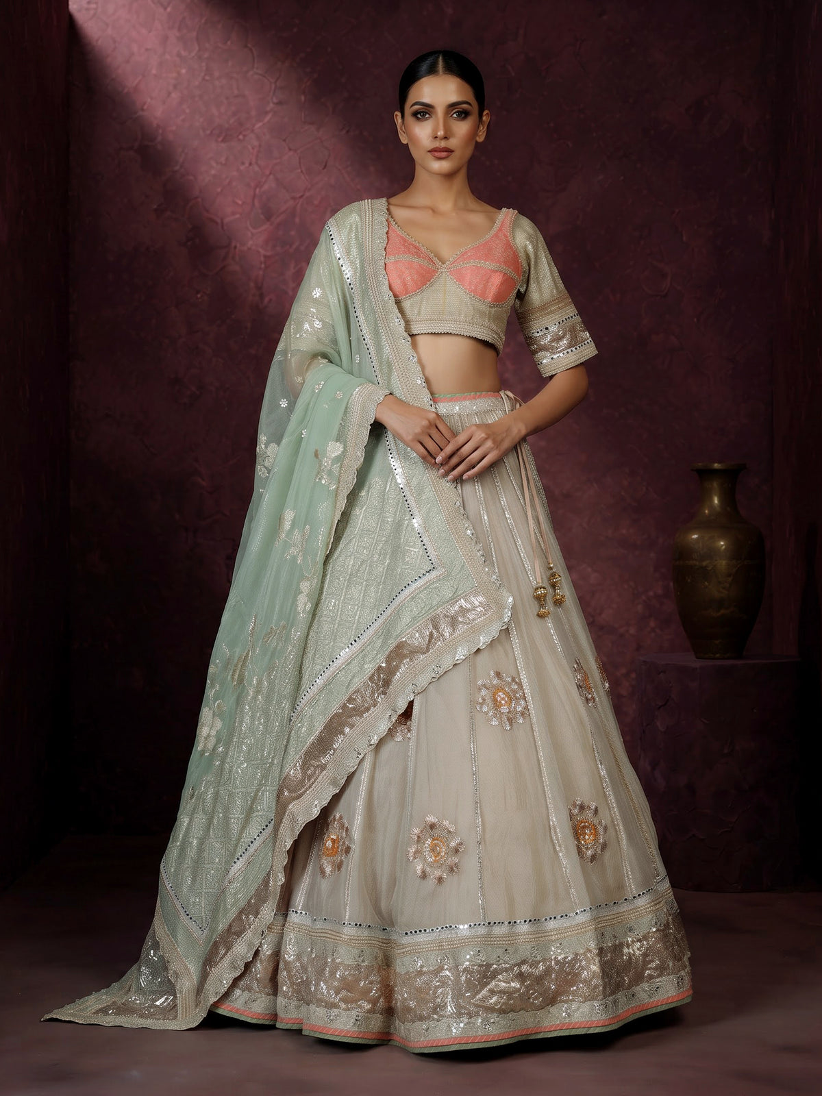 Pastel beige tissue lehenga choli with contrast dupatta embellishments